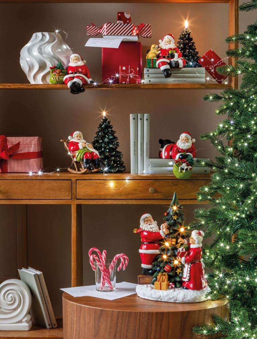 L'Oca Nera - Natale 2025 "Regali per tutti" Babbo Natale su sedia a dondolo