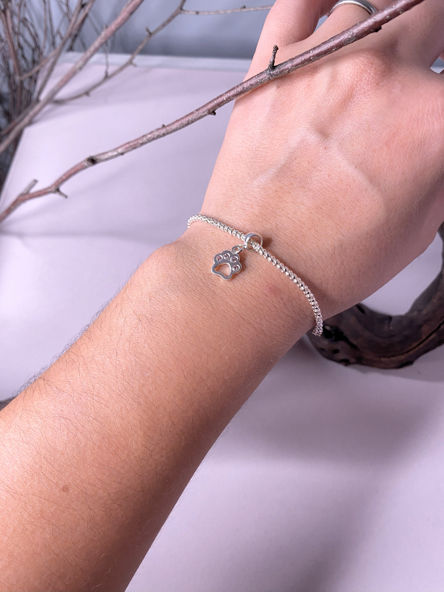 Zampetta, Charm y Pulsera