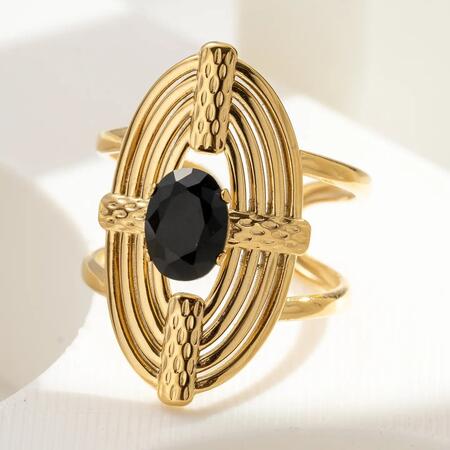 Anello regolabile in acciaio dorato con cristallo nero ovale