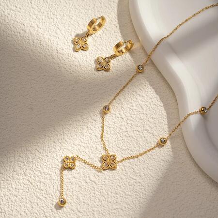 Set collana e orecchini in acciaio inox con quadrifoglio