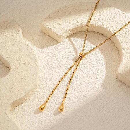 Collana scorrevole dorata in acciaio inossidabile con perline a goccia