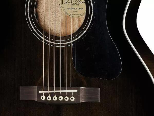 GUILD OM260CE DELUXE FLAMED MAHOGANY TRANSPARENT BLACK BURST